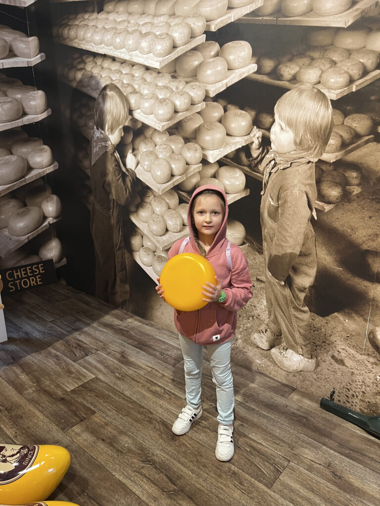 Zaanse Schans tour — child with a wheel of traditional Dutch cheese